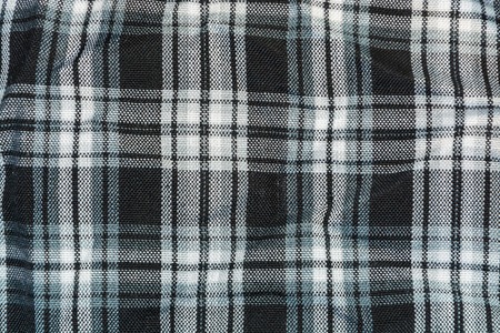 background, texture of black-and-white checkered linen fabricの写真素材