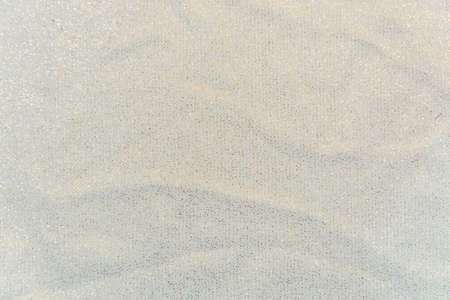 The White knitted fabric with gold glitter
