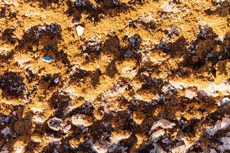 texture of a light tan sand and stones