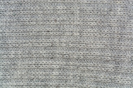 Detail of crocheted texture from a sweater made of wool closeupの写真素材