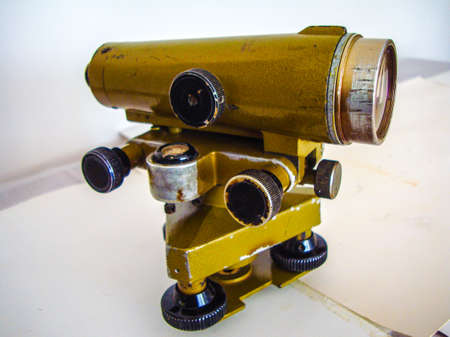 Old binoculars on a white background. View from the side.の写真素材