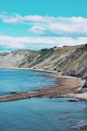 Steep coast on the flysch route in the Basque country in Spain on June 21, 2021
