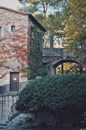 house with a small bridge in the gardens that surround the Girona cathedral in Catalonia, Spain, on December 9, 2023のeditorial素材