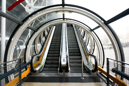 escalator up and down with tunnel in modern building