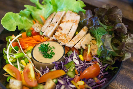 close up of chicken salad with vegetable and tomatoの写真素材