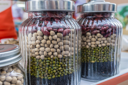 Vaious of beans and peas, green, red and black sesame protein in the jarsの写真素材