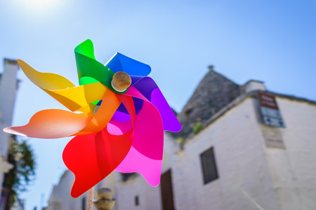 Closed up shot of colorful rainbow pinwheel in sun shine summer day.の写真素材