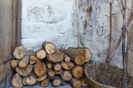 Pile of firewood with stone wall prepare for fire camp for the winter.の写真素材
