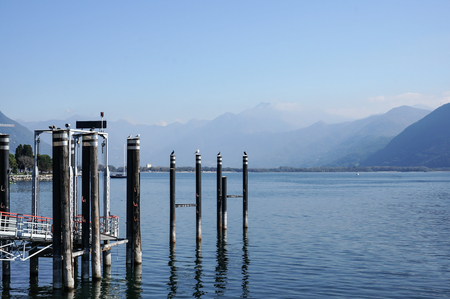 relax view of jetty, dock with birds in blue lake summer vacation.の写真素材