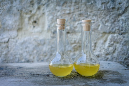 traditional natural liquid soap in the bottles with stone background in Matara, Italy.