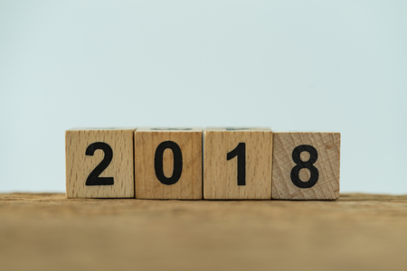 Cube wooden block with number 2018 as minimal 2018 new year calendar concept.の写真素材