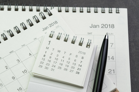 Calendar planning with pen on black background using as date orgainizer or year plan concept.の写真素材