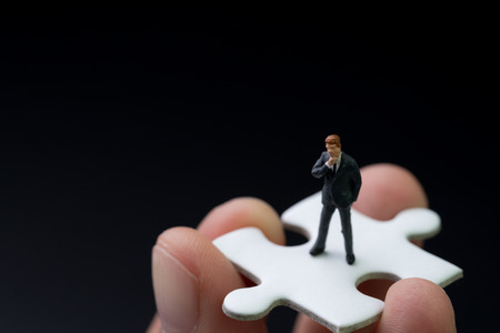 Missing piece person for business success concept, miniature people businessman thinking and...