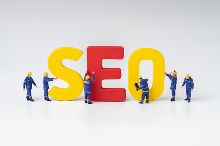 SEO, Search Engine Optimization ranking concept, miniature people figure workers team building alphabets abbreviation SEO on white background , the idea of promote traffic to website.の写真素材