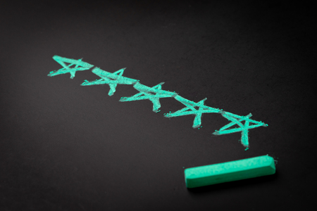 User reviews, UX User Experience concept, selective focus on pastel green 5 stars with copy space,...