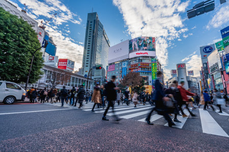 Shibuya, Tokyo, Japan - December 26, 2018: Crowd pedestrians people walking on zebra crosswalk at...