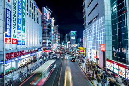Shinjuku, Tokyo, Japan - December 24, 2018: View of street and cityscape at night with colorful advertisement billboard light in Shinjuku district at night in Tokyo, Japan.のeditorial素材