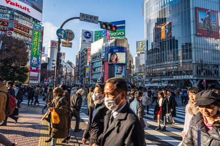 Shibuya, Tokyo, Japan - December 26, 2018: Crowd pedestrians people walking on zebra crosswalk at Shibuya district in Tokyo, Japan in the morning. Famous busiest shopping for tourist and business.のeditorial素材