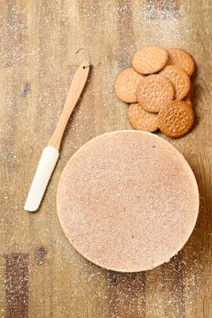 Dark and white chocolate cake with cookies on wood backgroundの写真素材
