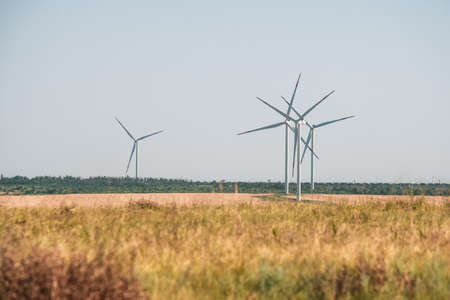 Wind turbines in an arid landscape. An alternative way of generating electricityの写真素材