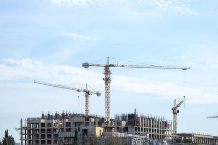 Moscow. Russia. September 06, 2020 View of the construction of a modern monolithic house against the background of the sky. Tower cranes in the construction of a high-rise apartment buildingのeditorial素材