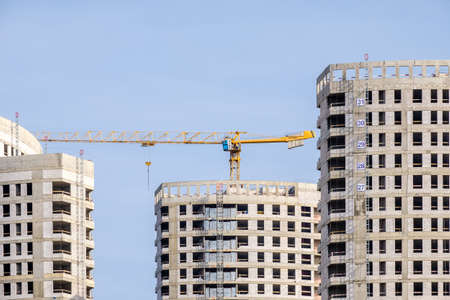 Moscow. Russia. September 06, 2020 View of the construction of a modern monolithic house against the background of the sky. Tower cranes in the construction of a high-rise apartment buildingのeditorial素材