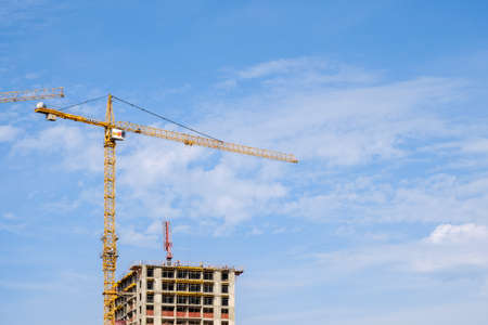 Moscow. Russia. September 06, 2020 View of the construction of a modern monolithic house against the background of the sky. Tower cranes in the construction of a high-rise apartment buildingのeditorial素材