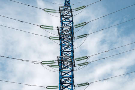 High voltage power line mast against the background of the sky. Wires and insulatorsの写真素材