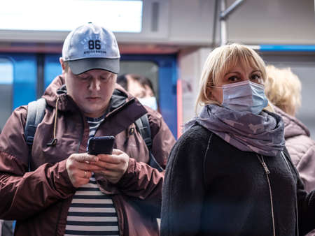 Moscow. Russia. September 28, 2020. A young woman in a subway car. The passenger has a protective...