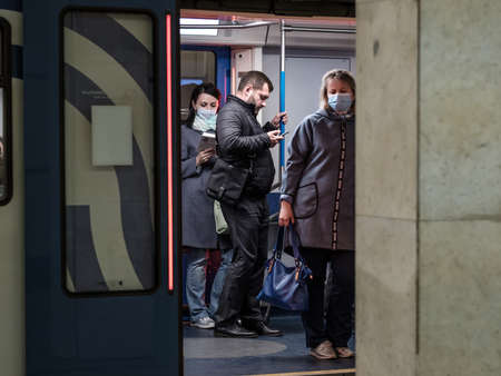 Moscow. Russia. September 28, 2020. A woman in a subway car. The passenger has a protective medical...
