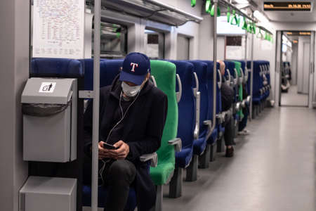 Moscow. Russia. October 4, 2020. A man in a subway car. The passenger has a protective medical mask on the face.のeditorial素材