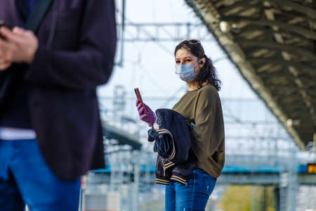 Moscow. Russia. October 4, 2020 A young girl in a protective mask stands on a subway station platformのeditorial素材