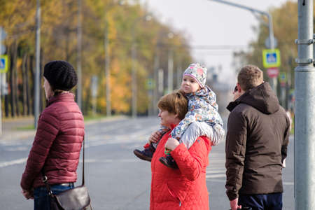 Moscow. Russia. October 11, 2020 A little toddler girl sits on the shoulders of an adult woman.のeditorial素材