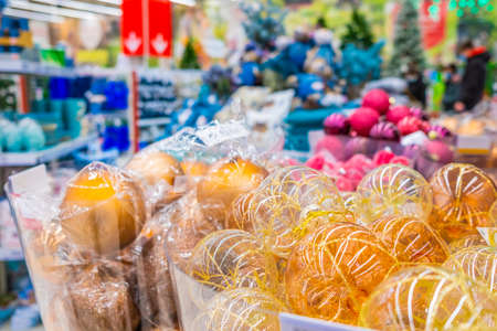Moscow. Russia. November 22, 2020: Colorful Christmas balls are sold at the department store. New Years Eve sale of tree decorations and Christmas toys.のeditorial素材