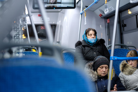 Moscow. Russia. December 3, 2020. Adult woman wearing a surgical protective mask on public...