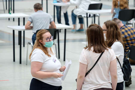 Moscow. Russia. 01 August 2021. An administrator wearing a face mask sees patients at a modern coronavirus vaccination center in Moscow.のeditorial素材