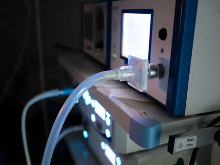Selective focus on the transparent insufflator hose in the operating room. Insufflator surgical...