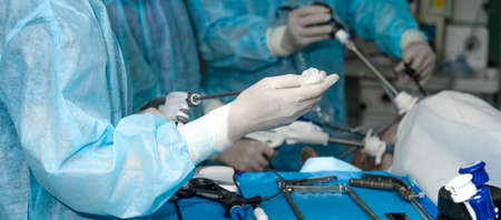 Surgical laparoscopic manipulator for minimally invasive proctological surgery in the hands of a...