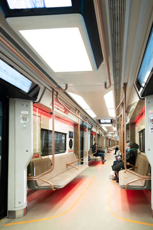Moscow. Russia. December 8, 2021. Passengers in an endlessly long pullop-empty subway car. The interior of the Moscow metro carriage.のeditorial素材
