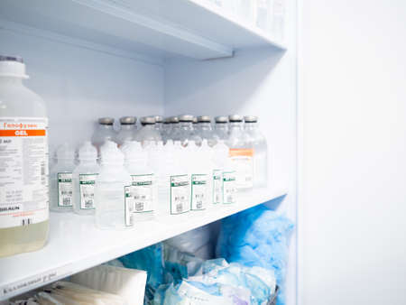 Moscow. Russia. December 24, 2021. Many of medicine bottles on the rack in the operating room. Details of operating medicine. Selective focus.のeditorial素材