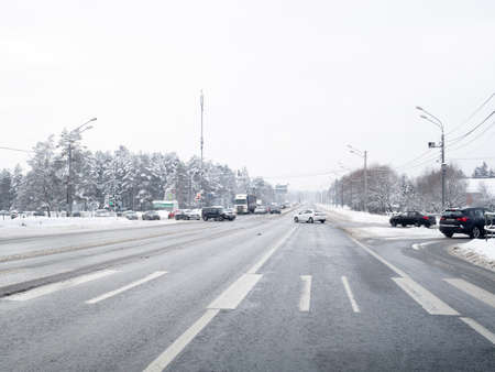 Moscow region. Russia. January 29, 2022. Cars cross an intersection on a suburban highway. The...