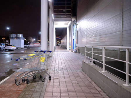 View of empty shopping carts outside the store at night. Selective focus.の写真素材