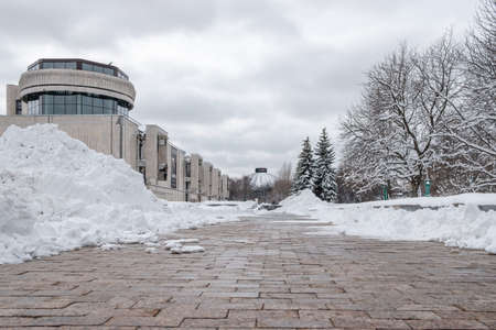 Moscow. Russia. April 3, 2022. View of the childrens musical theater of Natalya Sats against the backdrop of huge piles of snow.のeditorial素材