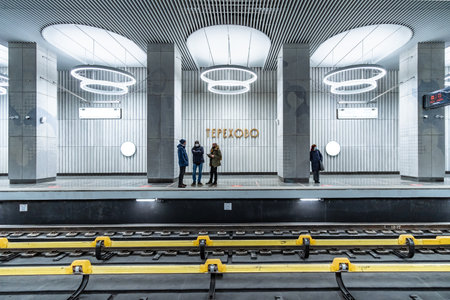 Moscow. Russia. December 7, 2021. The interior of the new station Terekhovo in the Moscow metro. Silhouettes of passengers on the platform of the Moscow metro station.のeditorial素材