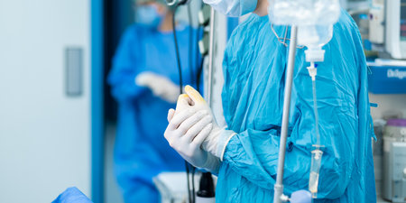 Surgeons hands in sterile gloves. Selective focus.の写真素材