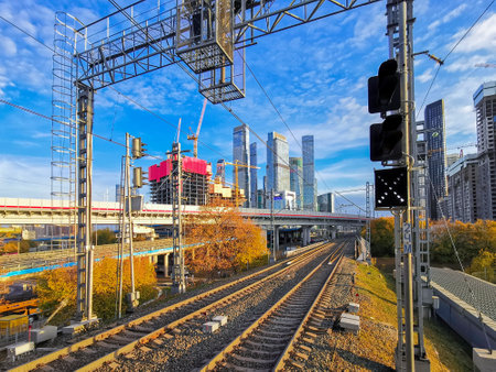 MOSCOW. RUSSIA. October 15, 2022. Panoramic view of the railway track of the Moscow Central Ring against the backdrop of skyscrapers and blue sky on a sunny day.のeditorial素材