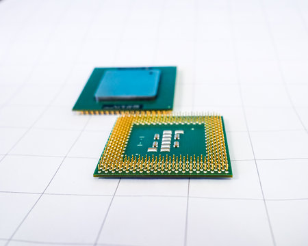 Selective focus on golden pins of computer processor on white background.の写真素材