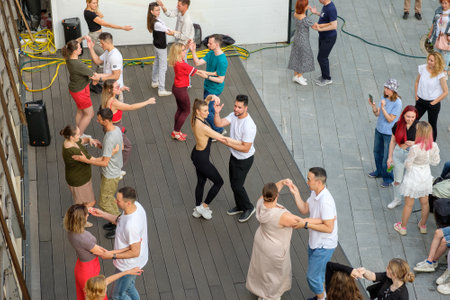 Moscow. Russia. July 1, 2023. People dance bachata on the street dance floor.のeditorial素材