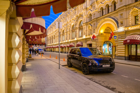 Moscow. Russia. May 20, 2023. A Range Rover car in Vetoshny Lane in Moscow in the evening against the backdrop of the Main Department Store.のeditorial素材