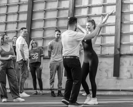 Moscow. Russia. July 1, 2023. Moscow. Russia. July 1, 2023. Beautiful couple dancing bachata outdoors in summer. Black and white photo.のeditorial素材